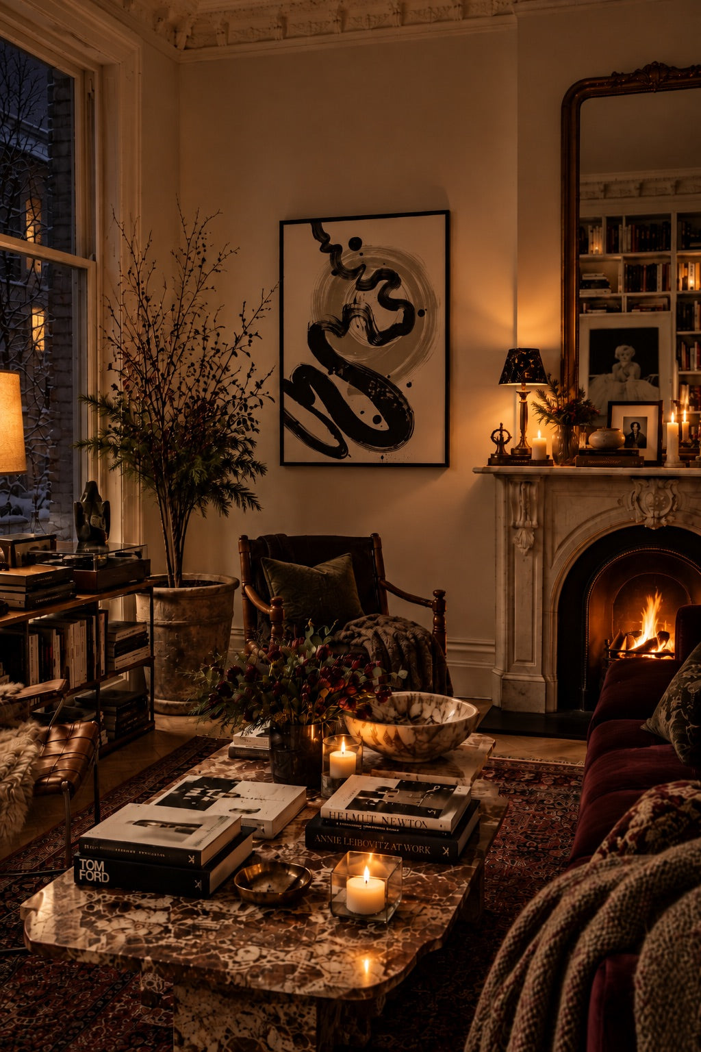 Cosy winter living room with abstract wall art, a fireplace, lamplight and layered textiles